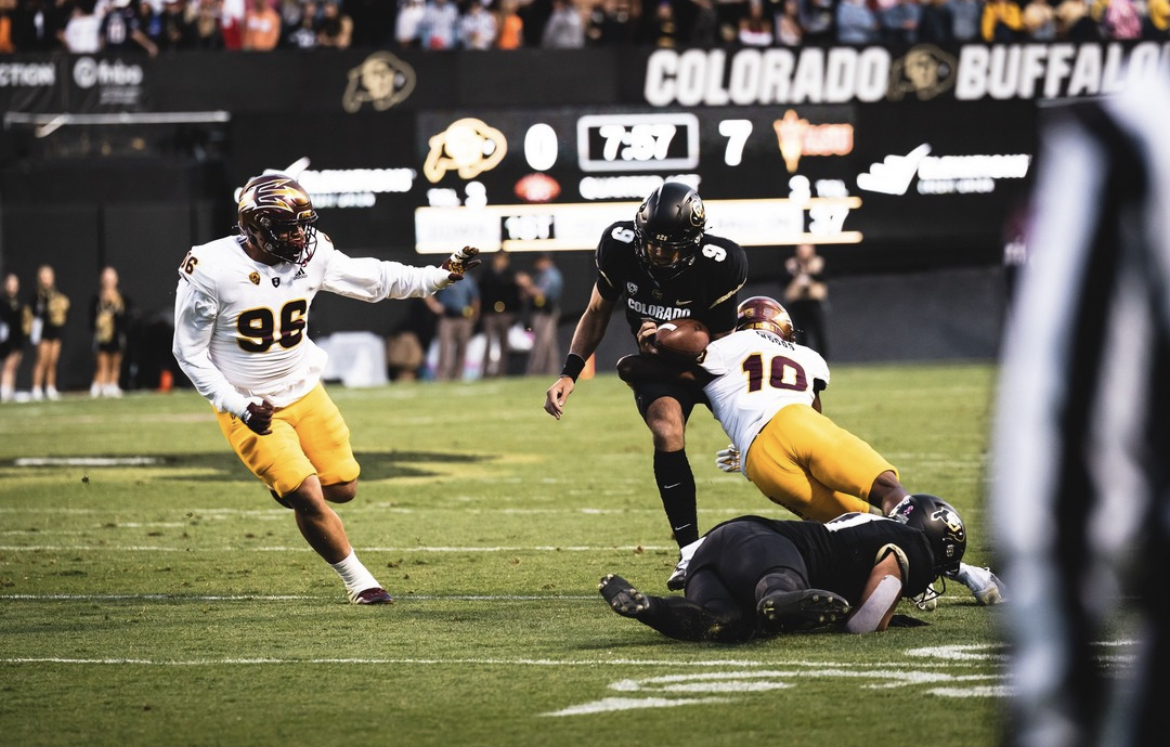 Arizona State defender makes a tackle against Colorado.