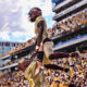 X Valladay celebrates a touchdown in Arizona State football's victory over Washington in 2022.