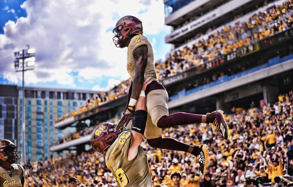 X Valladay celebrates a touchdown in Arizona State football's victory over Washington in 2022.