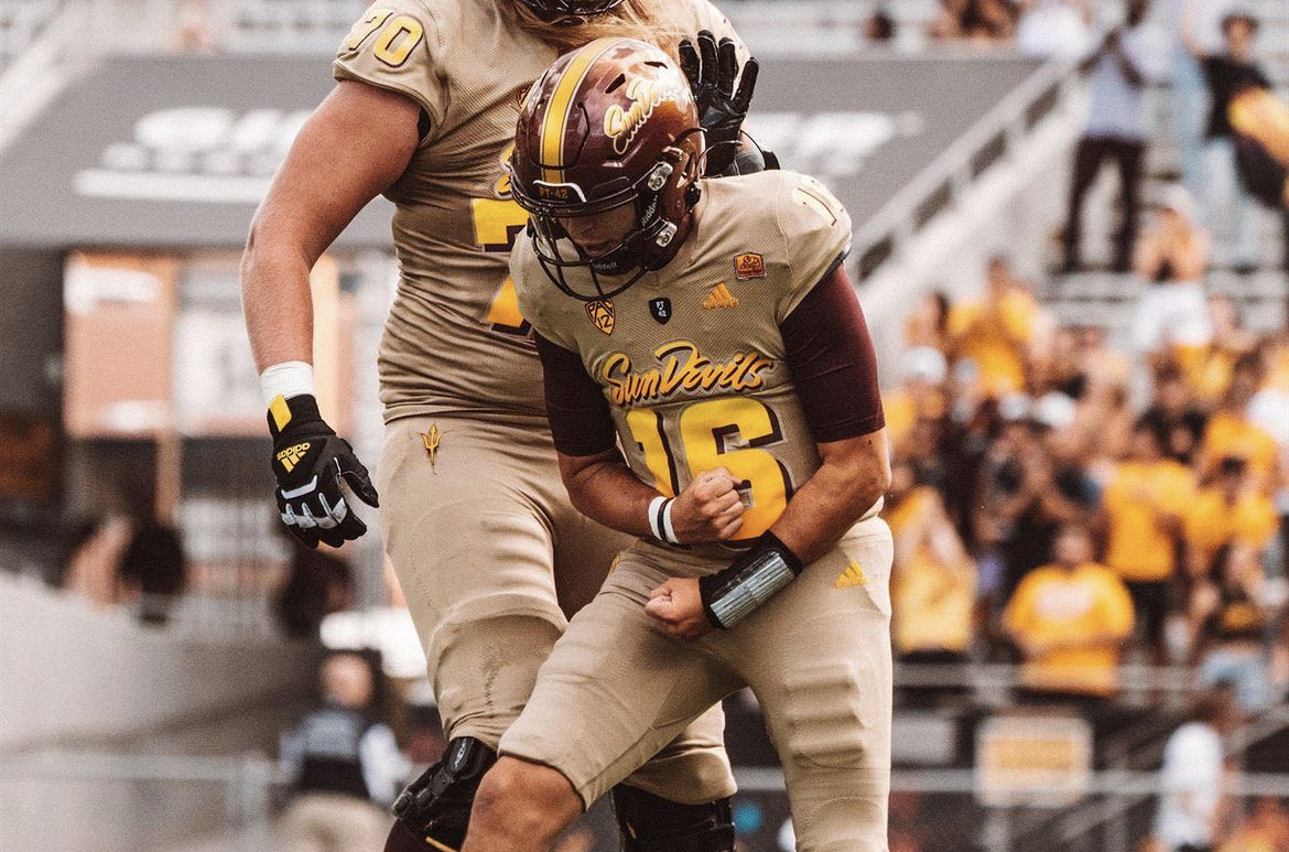 Arizona State QB Trenton Bourguet celebrates a touchdown against Washington.