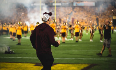 ASU football head coach Kenny Dillingham jogs out of the tunnel against Southern Utah.