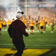 ASU football head coach Kenny Dillingham jogs out of the tunnel against Southern Utah.