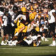 An Arizona State player making a tackle against Colorado.