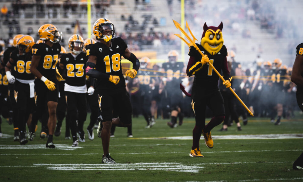 Arizona State football running on to the field.