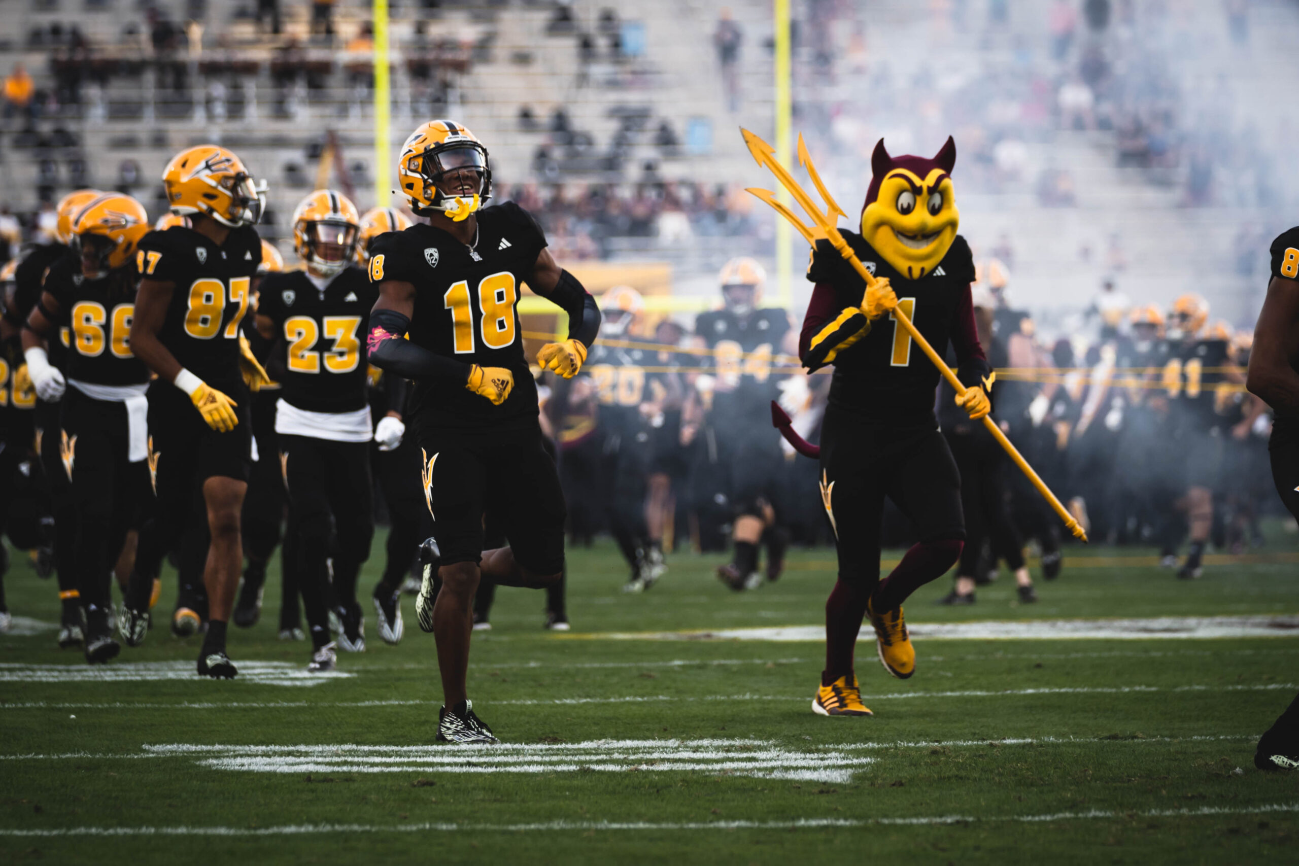 Arizona State football running on to the field.