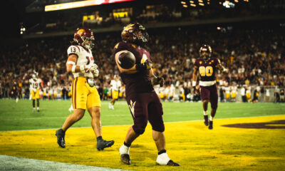 Arizona State football player Cam Skattebo celebrates a touchdown against USC.