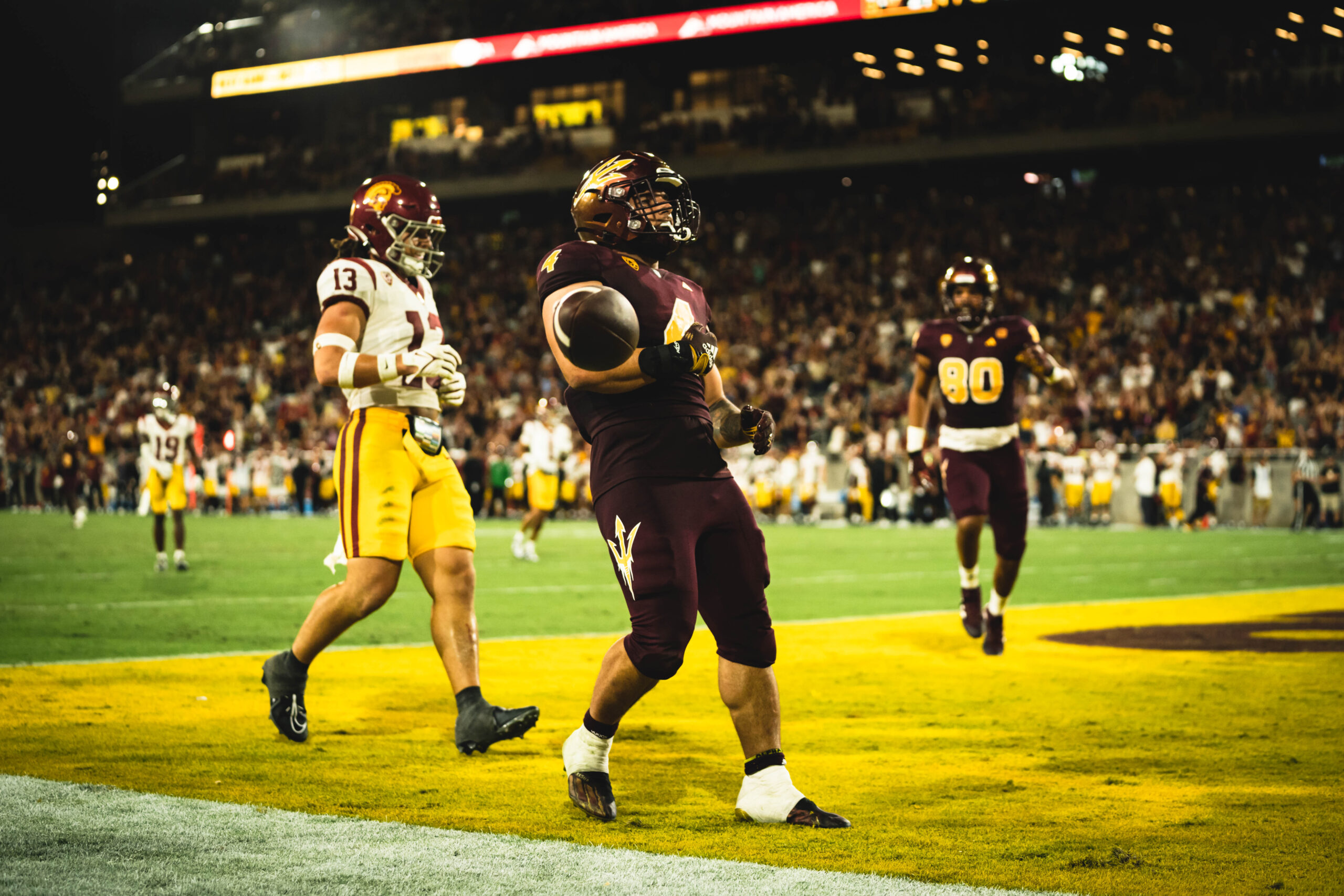 Arizona State football player Cam Skattebo celebrates a touchdown against USC.