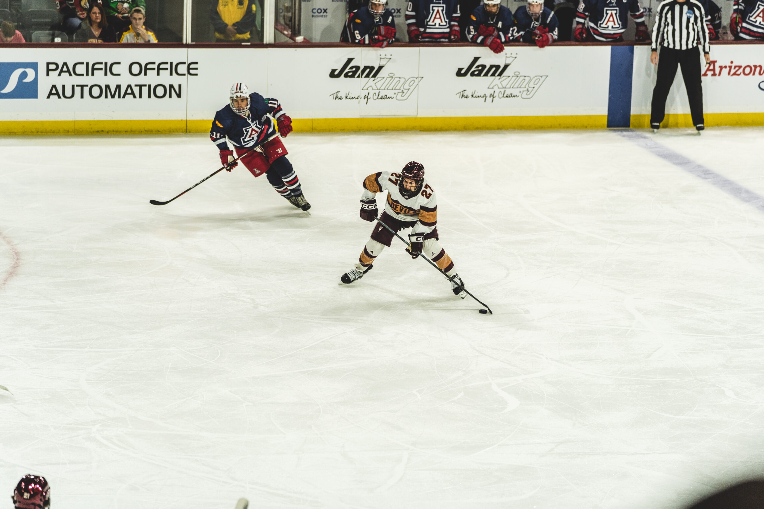 Arizona State hockey player skates against Arizona.