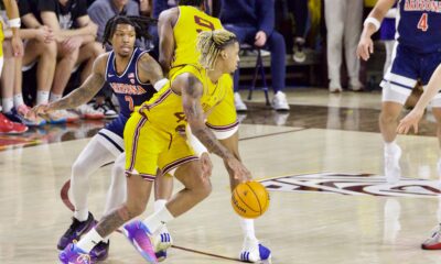 Arizona State basketball player Adam Miller dribbles against Arizona.