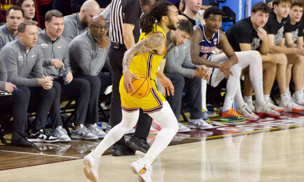 Frankie Collins of Arizona State basketball dribbles against Arizona.