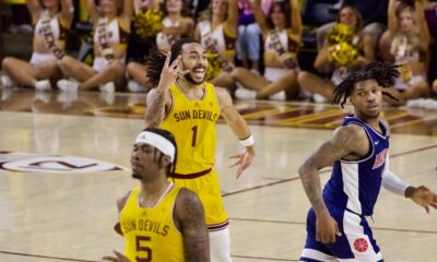 Frankie Collins celebrates a three against Arizona.