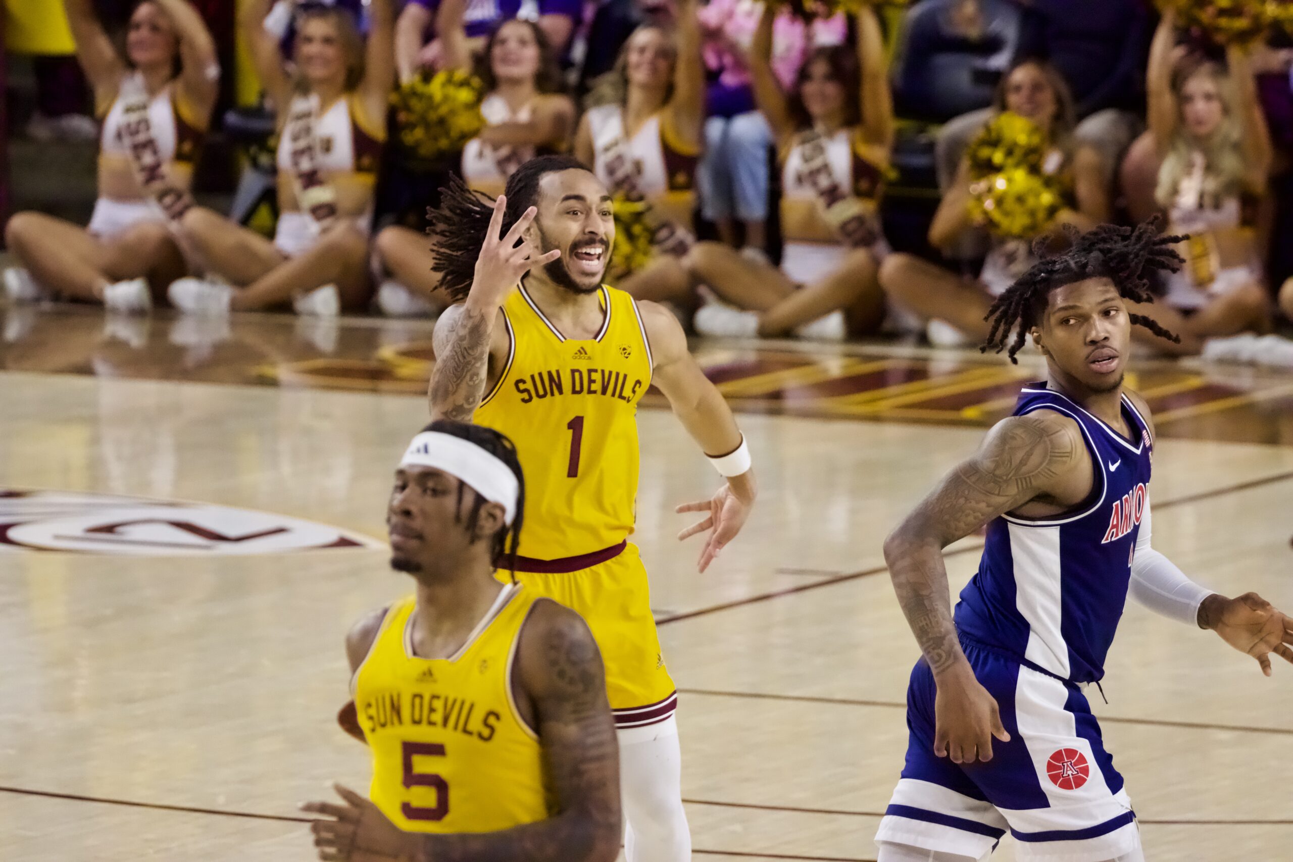 Frankie Collins celebrates a three against Arizona.