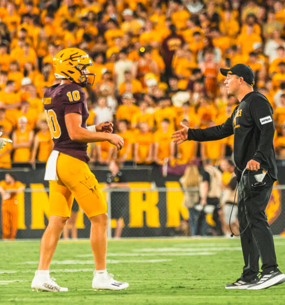 Kenny Dillingham and Sam Leavitt of ASU football talk on the sideline against Wyoming.