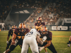 Sam Leavitt of ASU football takes a snap against Kansas at Mountain America Stadium on Oct. 5, 2024.