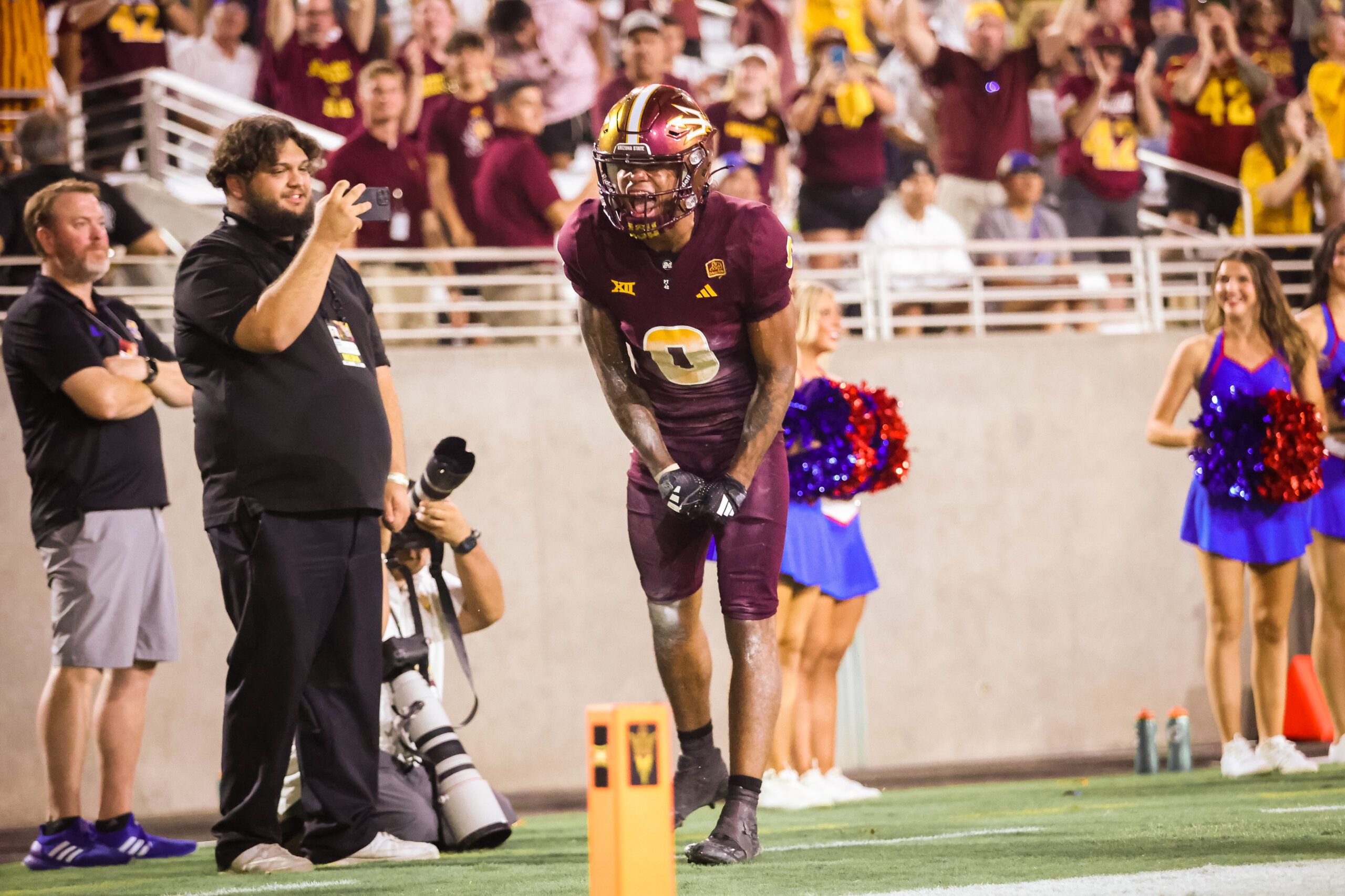 Jordyn Tyson of ASU football celebrates a touchdown against Kansas.