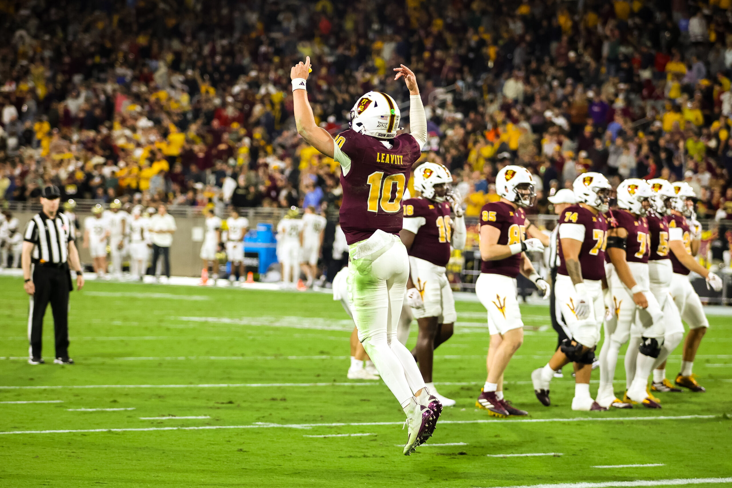 Sam Leavitt of ASU football celebrates a touchdown against UCF.