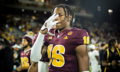 An Arizona State football player flashes "Forks Up" after a win over UCF.