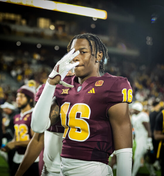 An Arizona State football player flashes "Forks Up" after a win over UCF.