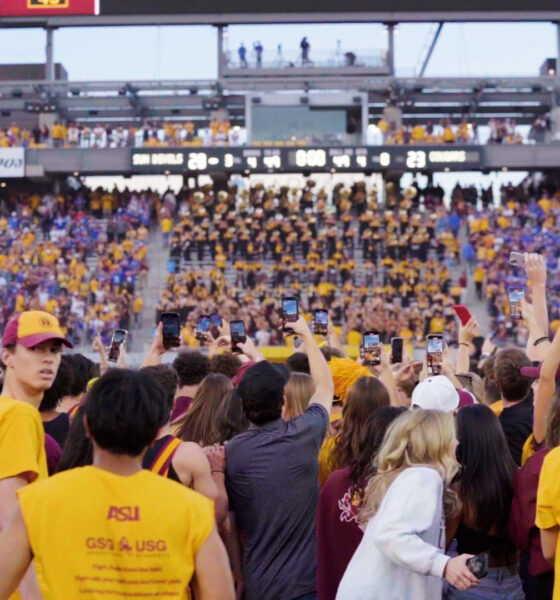 ASU football fans storm the field following a win over BYU.