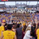 ASU football fans storm the field following a win over BYU.