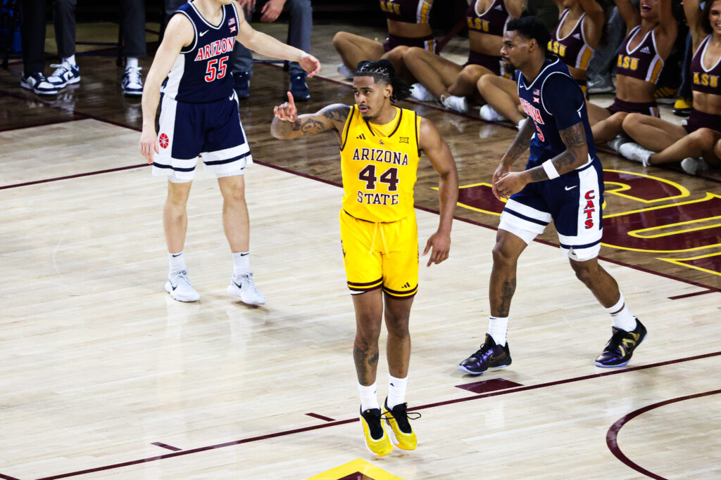 Adam Miller (center) points to a teammate after scoring a basket against Arizona on Feb. 1, 2025 at Desert Financial Arena. Miller scored 16 points in the loss.