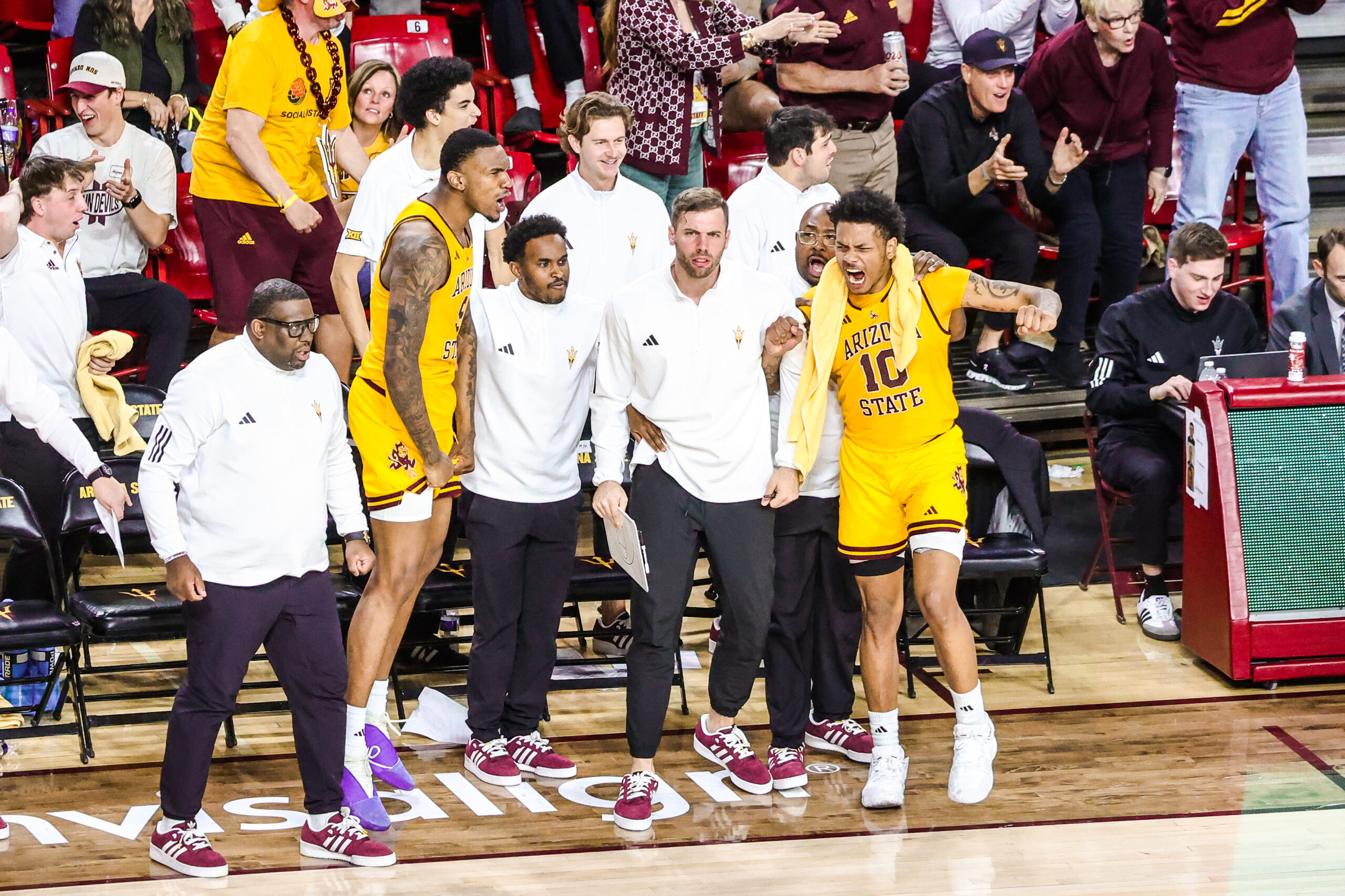 ASU coaches and player BJ Freeman react to an exciting moment in ASU's game against Arizona on Feb. 1, 2025 in Tempe.