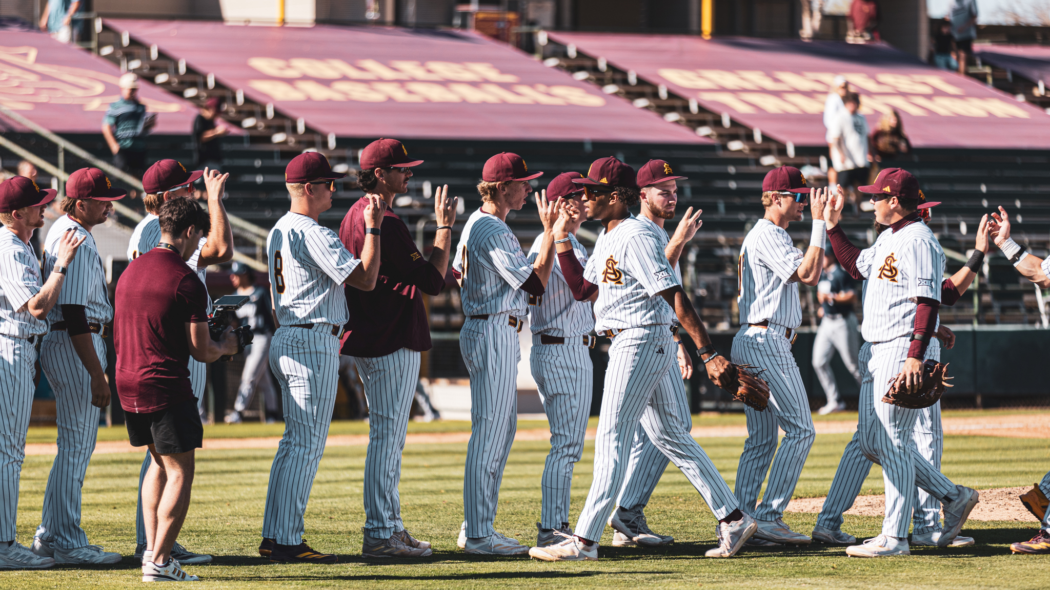 ASU baseball high fives each other before opening the series against Oral Roberts. (Photo by Joshua Eaton/Sun Devil Daily)