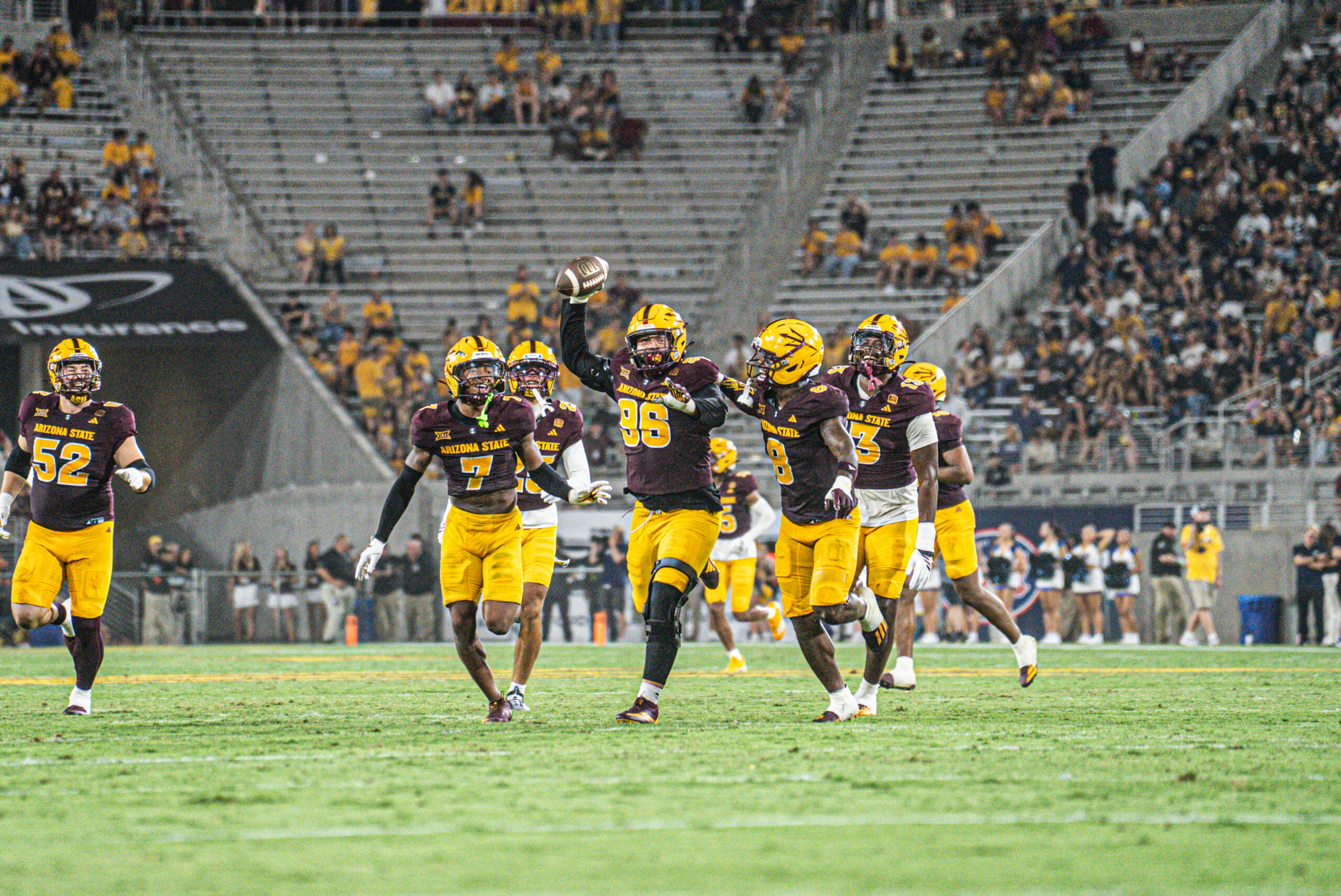 Anthonie Cooper (96) celebrates with his teammates against NAU on Aug. 30 2025, at Mountain America Stadium. (Photo by Sedona Levy/Sun Devil Daily)