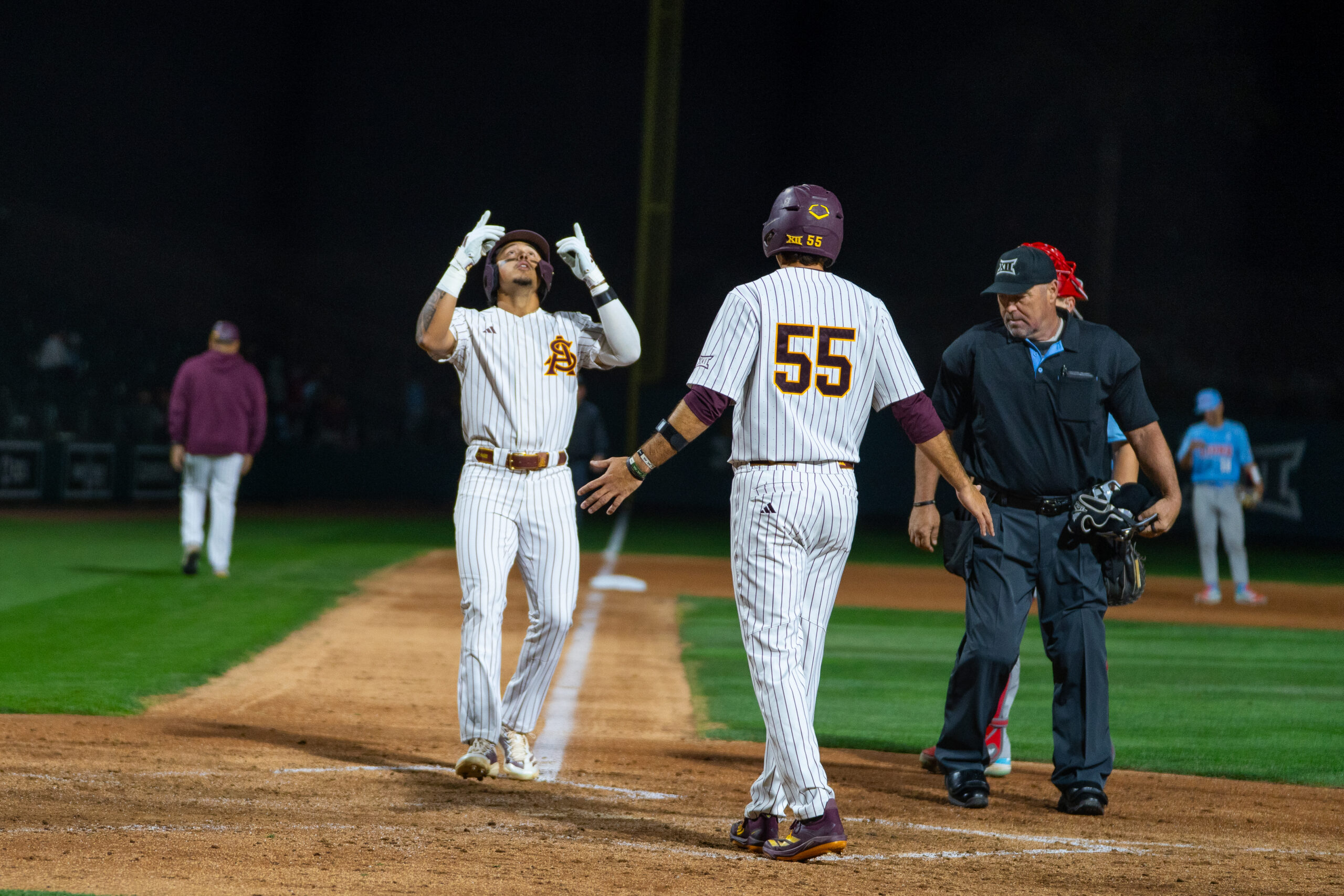 Nu'u Contrades points towards the sky after hitting a late home run for the Sun Devils in a Friday night matchup against LMU. Photo by Emma Gonzalez, Sun Devil Daily